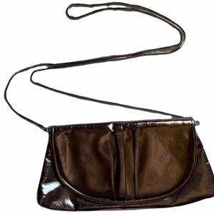 La Regale silver baguette purse with chain and snap closure